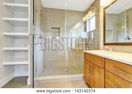 Bathroon Interior With Vanity Cabinet, Two Sinks And Opened Glass Shower Door