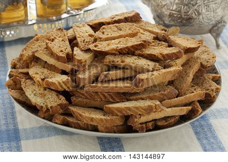 Dish with traditional Moroccan festive fekkas cookies and tea