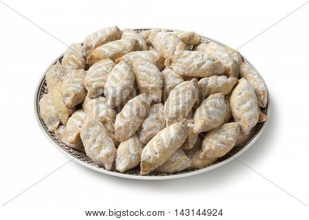 Dish with traditional Moroccan makrout, date cookies, on white background
