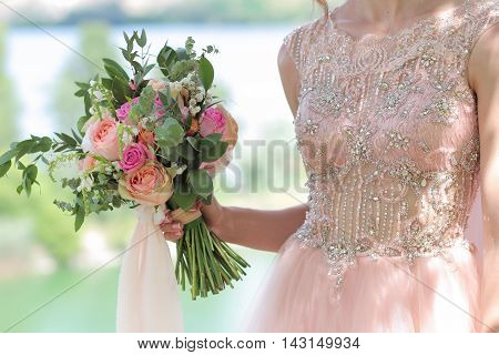 Beautiful Bridal Bouquet In Hands Of The Bride. Wedding Bouquet Of Peach Roses By David Austin,  Sin