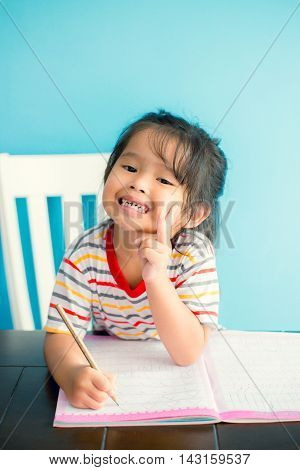 asian young girl children happy doing her homework people, family concept