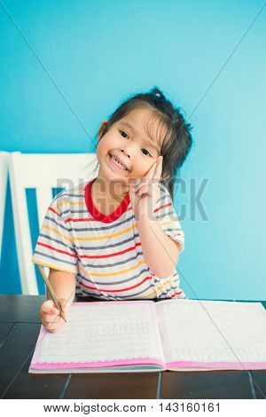 asian young girl children happy doing her homework people, family concept