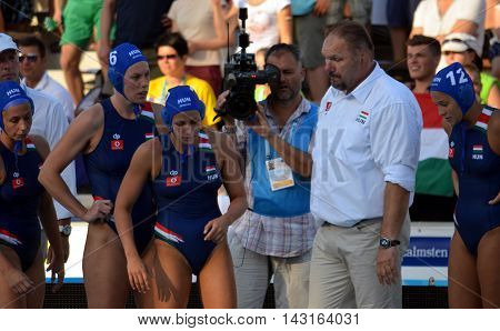Budapest, Hungary - Jul 16, 2014. Hungary's Andras MERESZ head coach talking about the tactics. The Waterpolo European Championship was held in Alfred Hajos Swimming Centre in 2014.