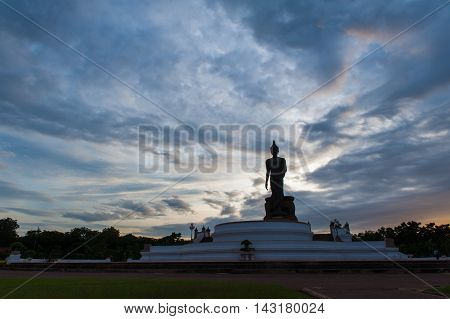 Sunset Over Walking Buddha Statue At Buddhamonthon (phutthamonthon), Buddhist Park In Nakhon Pathom,