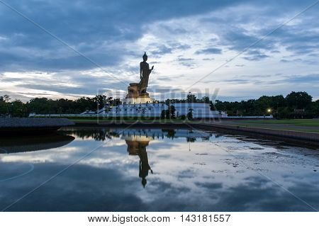 Walking Buddha Statue And Reflection On Water At Buddhamonthon (phutthamonthon), Buddhist Park In Na