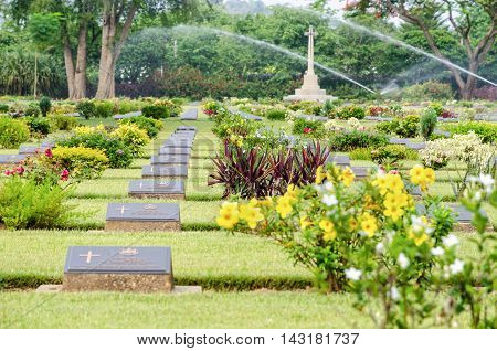 KANCHANABURI THAILAND - MAY 3 2014: Chungkai War Cemetery this is historical monuments where to respect prisoners of the World War 2 who rest in peace here MAY 3 2014 in Thailand