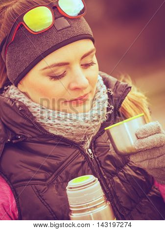 Hiker Woman Warming Up Drink Tea In Cold Day