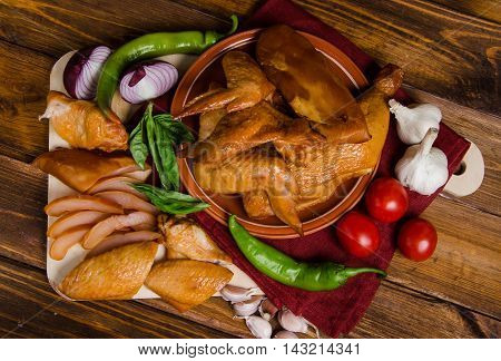 Grilled chicken set with vegetables on a wood