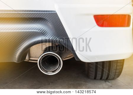 Chrome pipe of white powerful sport car bumper