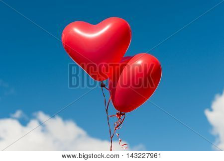 Valentine heart balloon against blue sky background