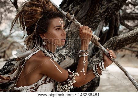 Attractive wild boho woman close up portrait