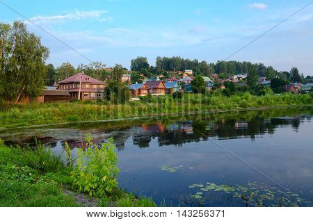 Quiet provincial town of Ples on shore of pond in summer twilight Russia