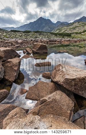 Brown stones in the water of Musalenski lakes, Rila mountain, Bulgaria