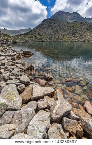 Reflection of Irechek peak in Musalenski lakes,  Rila mountain, Bulgaria
