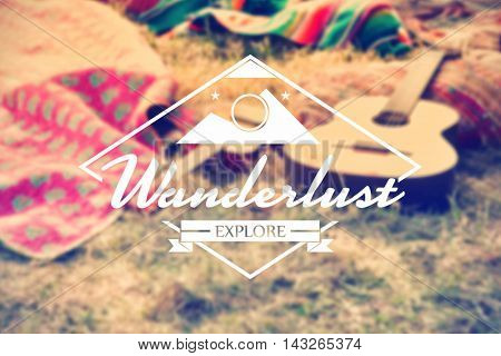 Wanderlust word against empty campsite at music festival