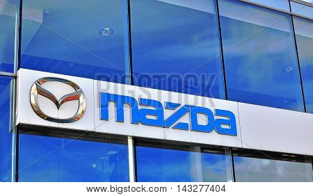 MOSCOW RUSSIA - OCTOBER 10 2015: Logo of Mazda corporation on October 10 2015. Mazda is a world-famous Japanese automotive manufacturer.