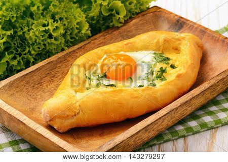 Khachapuri - traditional  caucasian pastry with cheese and eggs.