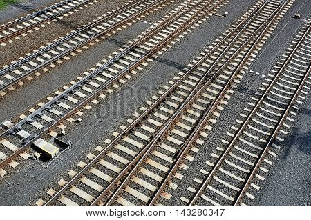 Empty railway lines with railroad swtich near town station