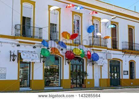 AYAMONTE / ANDALUCIA - AUGUST 14, 2015 - Umbrellas in typical street of ayamonte.