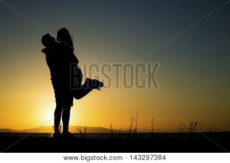 At sunset seaside dear young couple in love.