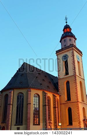 Katharinenkirche (St. Catherine' church) in the old city center at Hauptwache plaza illuminated in the evening.