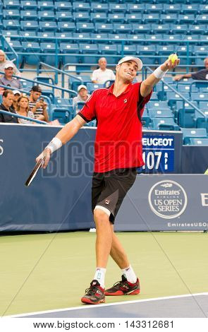 Mason Ohio - August 16 2016: John Isner in a match at the Western and Southern Open in Mason Ohio on August 16 2016.