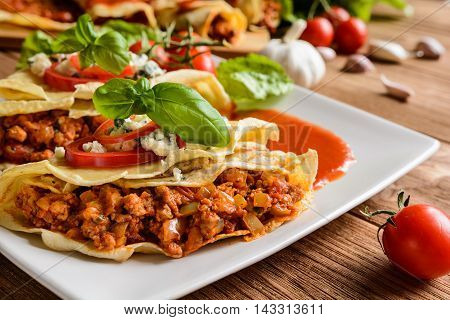 Stuffed Bolognese Pancakes With Minced Meat And Vegetable With Tomato Sauce