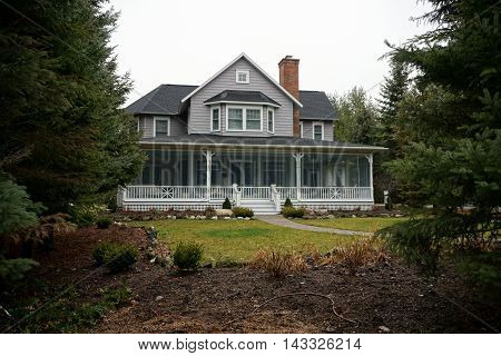 WEQUETONSING, MICHIGAN / UNITED STATES - DECEMBER 22, 2015: A large home on Pennsylvania Avenue in Wequetonsing.