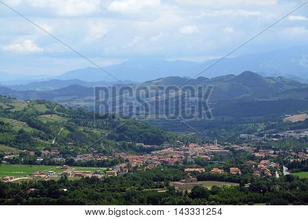 Urbania, Italy - August, 1, 2016: mountain landscape with a view of a small town Urbania in a North Italy