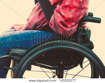 Disease disability paralysis handicap health concept. Legs of disabled person. Crippled female sitting on wheelchair.