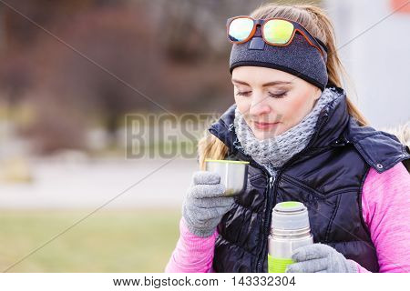 Hiker Woman Warming Up Drink Tea In Cold Day
