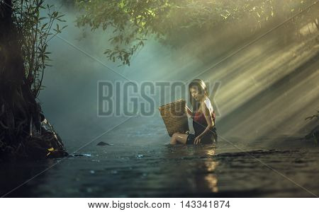 Asian sexy woman bathing in cascade Thailand