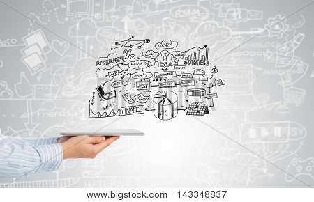 Businessman hand demostrating business strategy plan on tablet screen