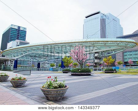 Nagoya Japan - April 15 2010: Colorful flowers in front of Oasis 21 a modern complex in Nagoya