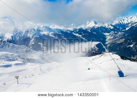 Snow machines make artificial snow in mountain ski resort Kals-Matrei, Austria.