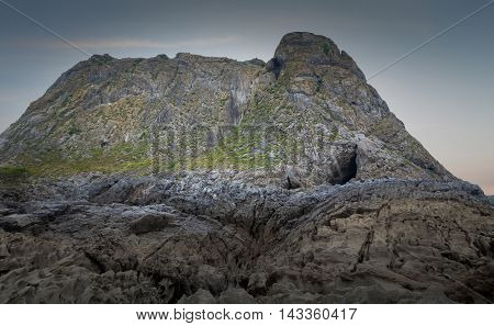 Paviland cave on the Gower peninsula, also known as Goat's Hole Cave, where a human male skeleton dyed in red ochre was discovered in 1823.