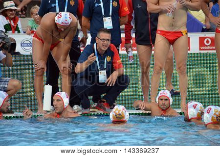 Budapest, Hungary - Jul 17, 2014. Montenegro's PEROVIC Ranko head coach talking about the tactics. The Waterpolo European Championship was held in Alfred Hajos Swimming Centre in 2014.