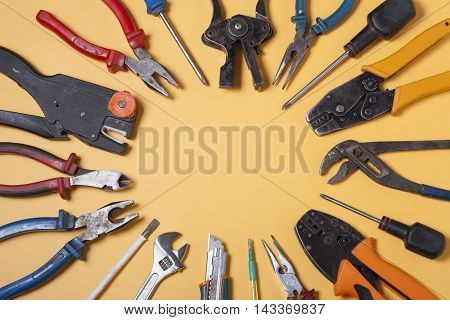 Set of electrical tool on wooden background. Accessories for engineering work, energy concept