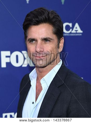 LOS ANGELES - AUG 08:  John Stamos arrives to the FOX Summer TCA Party 2016 on August 08, 2016 in West Hollywood, CA                