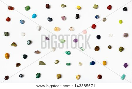 Many Semi-precious Stones Arranged On White