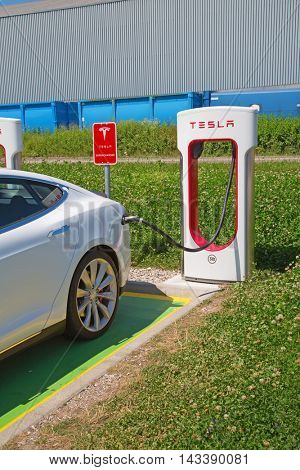 ZURICH - July 30:  Tesla Supercharger station on July 30, 2016 in Zurich, Switzerland. Tesla motors develops network of the charging stations across Europe and World.