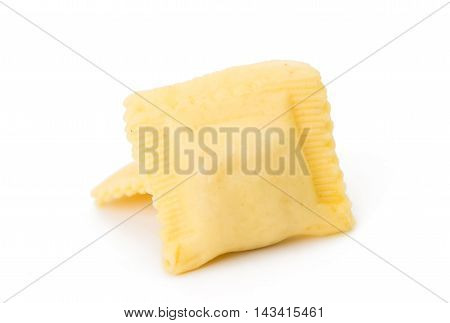 Ravioli pasta squares isolated over white background.
