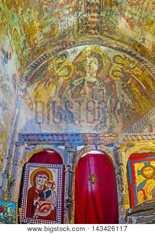 USHGULI GEORGIA - MAY 22 2016: The Altar of Lamaria Church decorated with icons old frescoes and patterns on May 22 in Ushguli.
