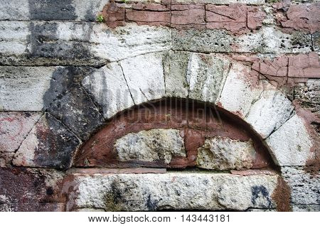Knitted outer walls of historic stone building built in 1571 in Istanbul Ottoman structure.