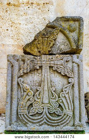 The broken medieval Khachkar with preserved relief of cross Haghartsin Monastery Armenia.