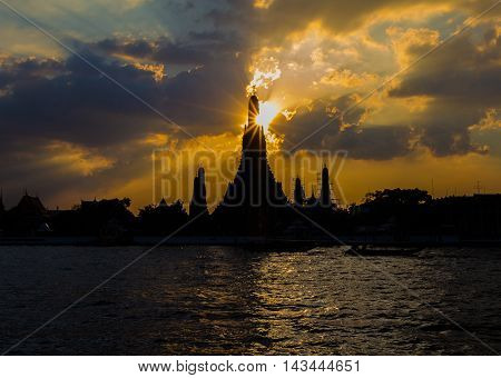 Silhouette of Wat Arun Temple along with Chaopraya River, Bangkok Thailand Landmark