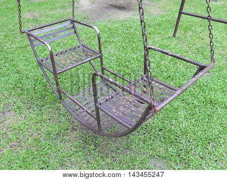 Swing on amusement park. kid toy in garden