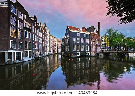 View of Amsterdam canal at sunset Netherlands