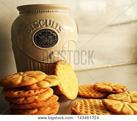 Delicious homemade biscuits with a traditional container