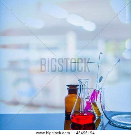 Glassware With Blur Laboratory In Background.